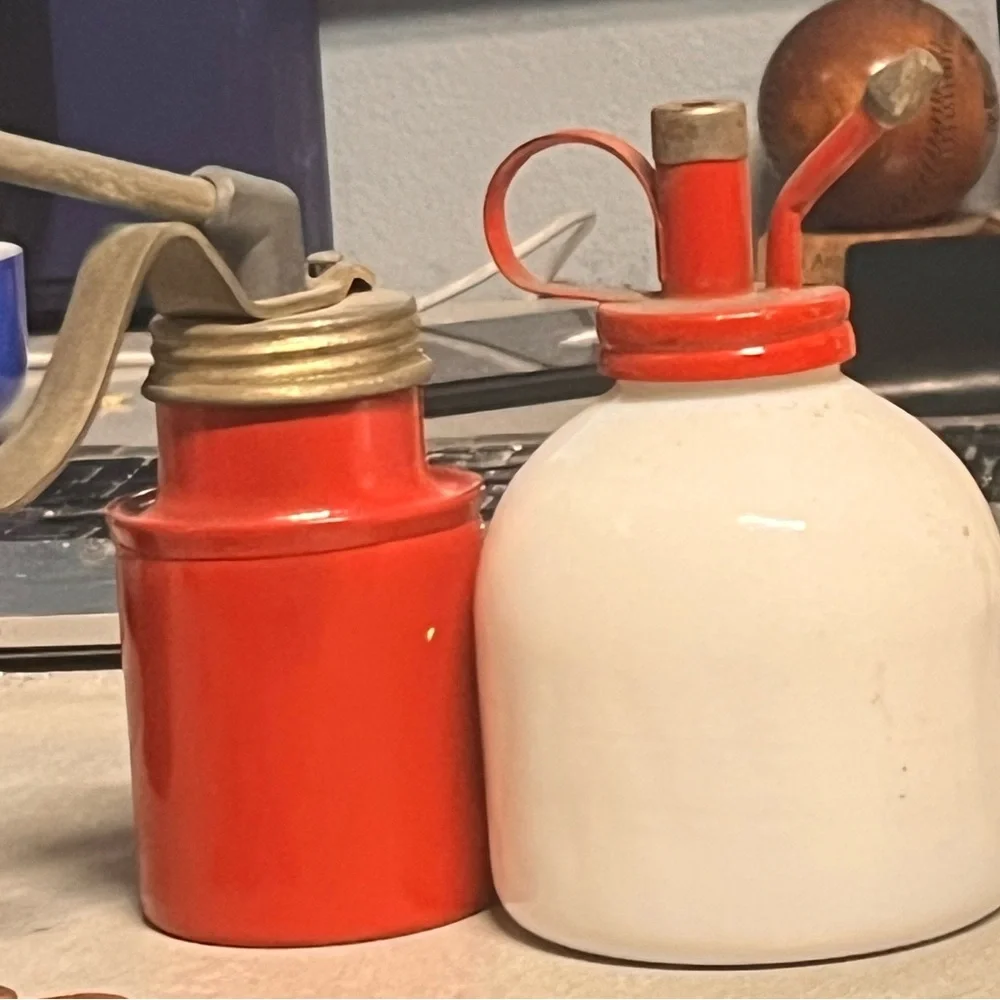 Milk glass plant mister and red brass plant mister